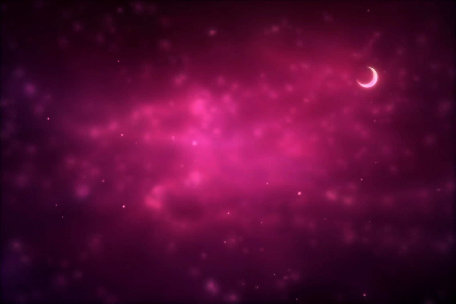 Un croissant de lune au-dessus d'un ciel étoilé teinté de rose